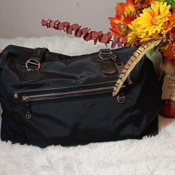 Tumi Ballistic BlackNylon w/ Leather trim small duffle bag.